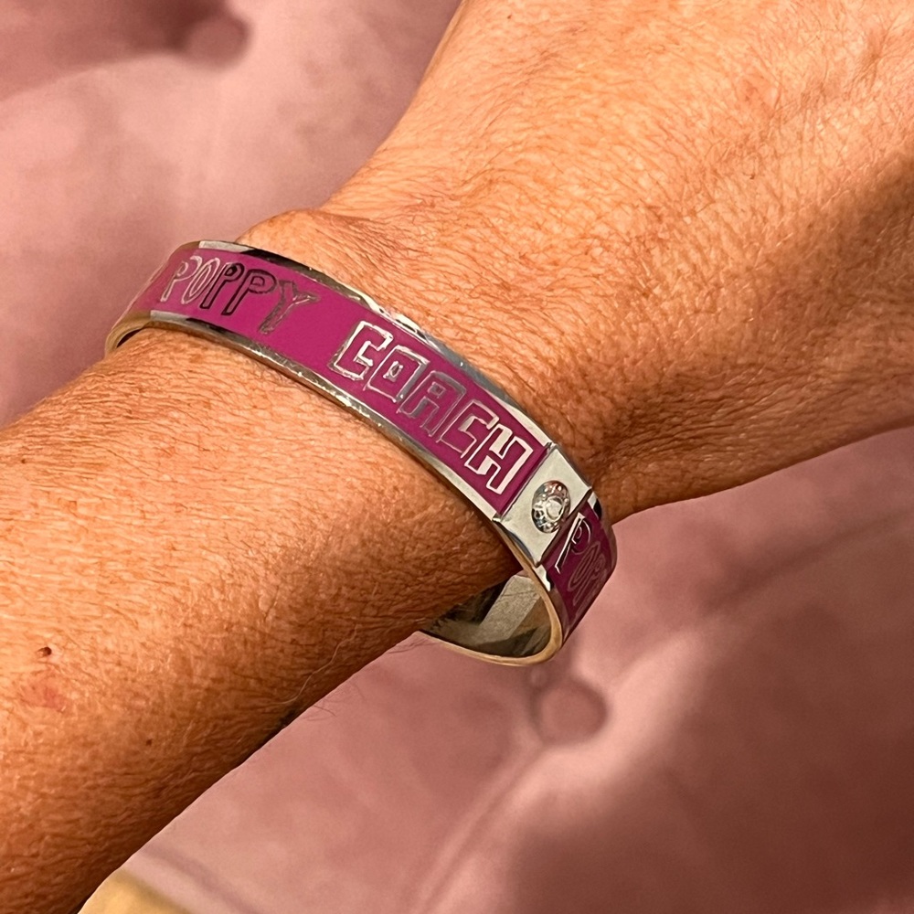 Coach Logo Pink Enamel
Poppy Bangle Silver Tone Bracelet